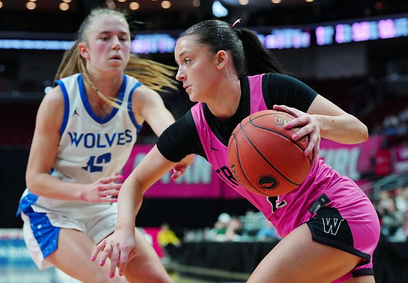 Iowa City West guard Ava Frese (2) drives with the ball around Waukee Northwest guard Sadie McCann (12) during the second quarter in the 5A girls state quarterfinal on March , 2026, at Casey’s Center in Des Moines, Iowa.