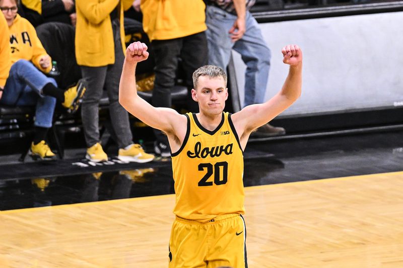 Feb 22, 2025; Iowa City, Iowa, USA; Iowa Hawkeyes forward Payton Sandfort (20) reacts after the game against the Washington Huskies at Carver-Hawkeye Arena. Mandatory Credit: Jeffrey Becker-Imagn Images