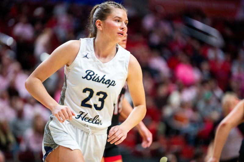 Bishop Heelan's Melina Snoozy (23) runs across the baseline on defense on March 3, 2026, at Casey’s Center in Des Moines.