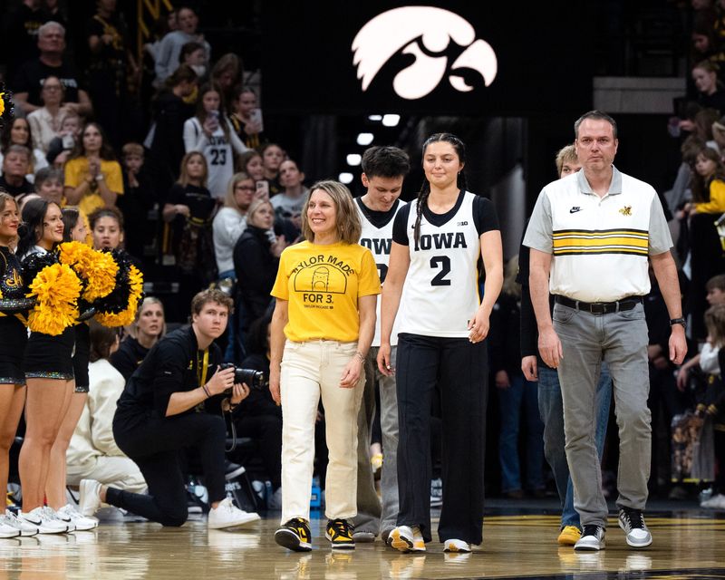 Iowa guard Taylor McCabe (2) walks onto the court for senior recognition on Feb. 22, 2026, at Carver-Hawkeye Arena in Iowa City, Iowa.
