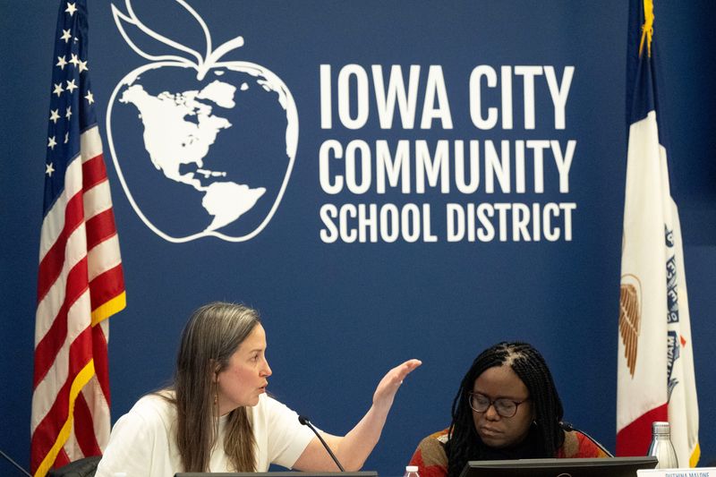 Director Lisa Williams, left, speaks as President Ruthina Malone listens March 3, 2026 during a special board meeting of the Iowa City Community School District in Iowa City, Iowa.