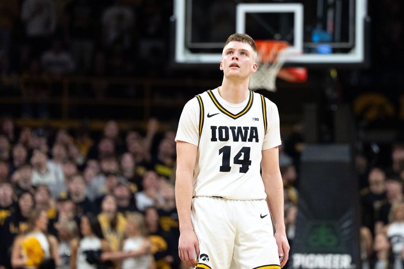 Iowa guard Bennett Stirtz (14) looks at a replay March 5, 2026 during a Big Ten basketball game against the Michigan Wolverines at Carver-Hawkeye Arena in Iowa City, Iowa.