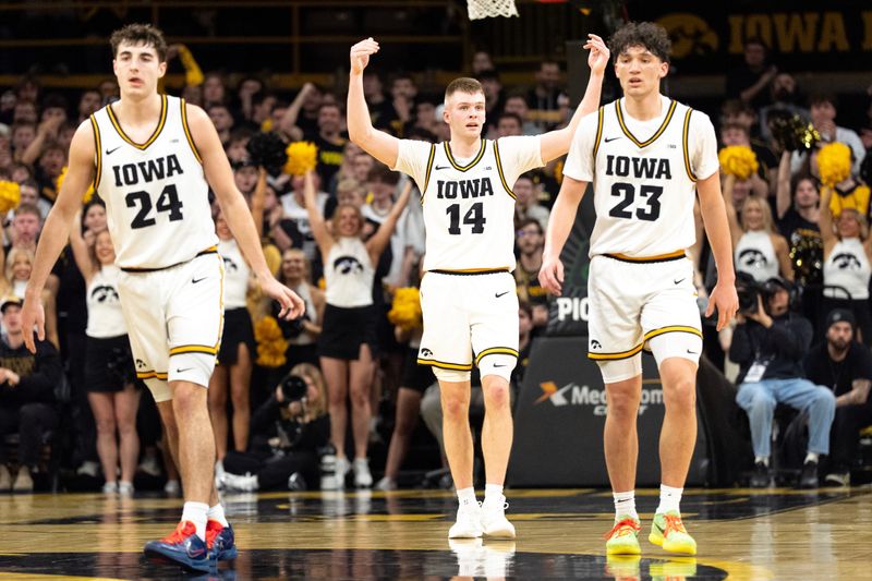 Iowa's players and fans, including Bennett Stirtz (14), provided the energy in the building but the Hawkeyes' upset bid of No. 3 Michigan fell short, 71-68.