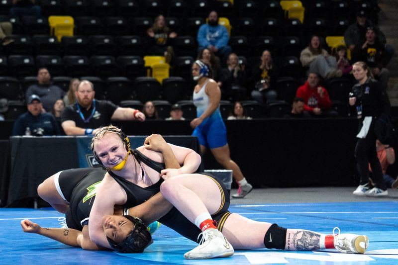 Iowa’s Katja Osteen looks to pin Felician’s Talisha Lewis in a 207-pound match March 6, 2026 during the NCAA Women’s Wrestling Championships at Xtream Arena in Coralville, Iowa.