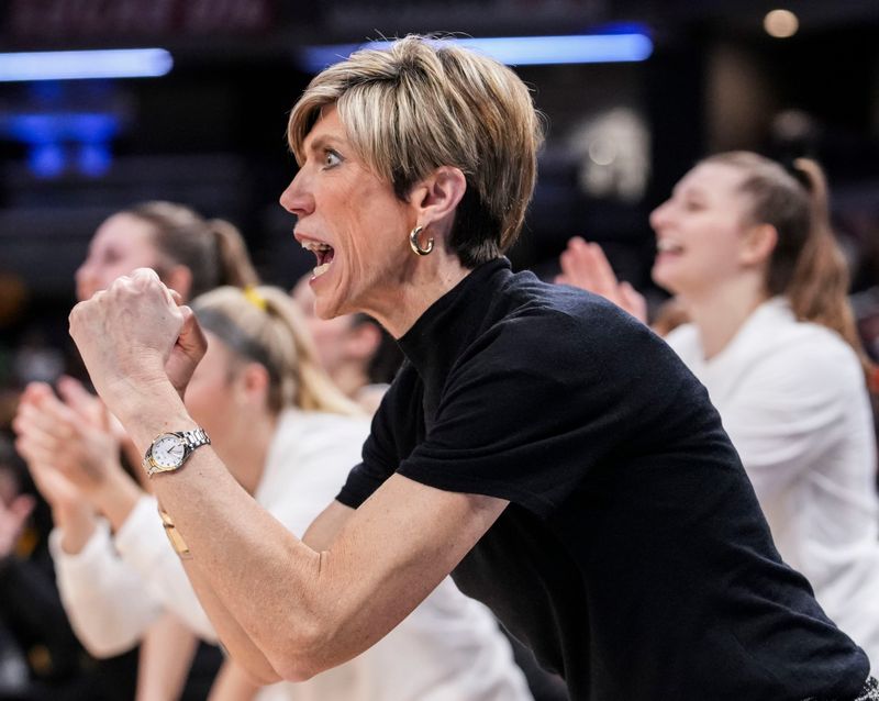 Iowa Hawkeyes head coach Jan Jensen celebrates Friday, March 6, 2026, during a Big Ten women's basketball tournament game at Gainbridge Fieldhouse in Indianapolis.