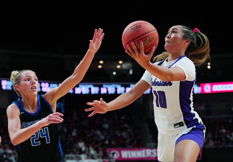 Johnston guard Jenica Lewis (10) goes for a layup around Waukee Northwest forward Logan Vogt (24) during third quarter in the 5A girls high school state basketball championship game on March 6, 2026, at Casey’s Center in Des Moines, Iowa.
