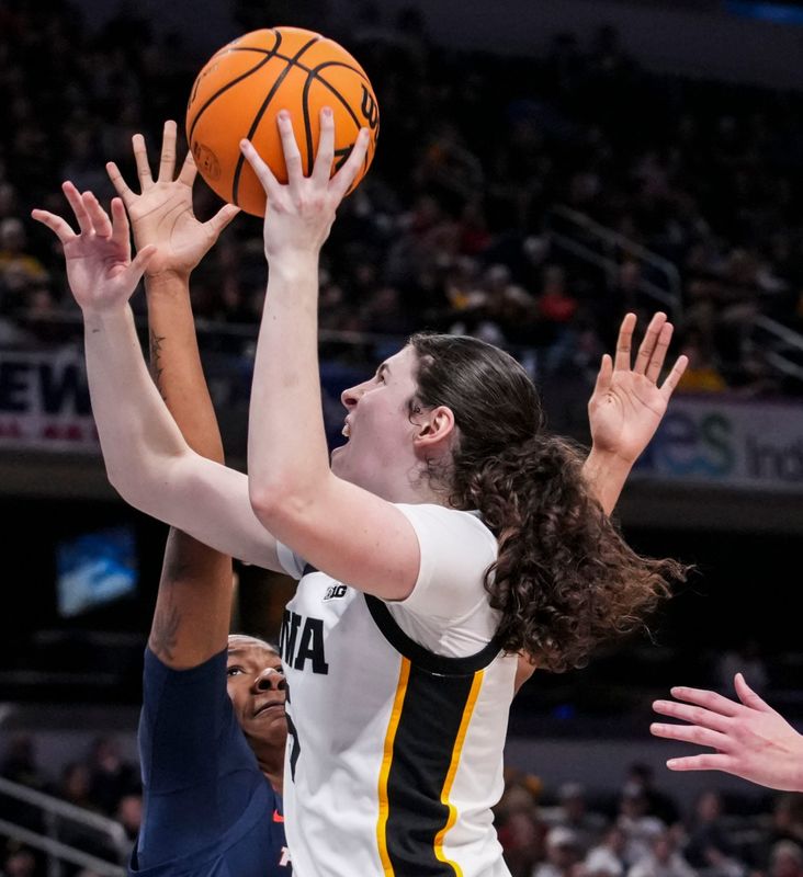 Iowa Hawkeyes center Ava Heiden (5) goes up for a basket against Illinois Fighting Illini forward Naomi Benson (21) on Friday, March 6, 2026, during a Big Ten women's basketball tournament game at Gainbridge Fieldhouse in Indianapolis. The Iowa Hawkeyes defeated the Illinois Fighting Illini, 64-58.