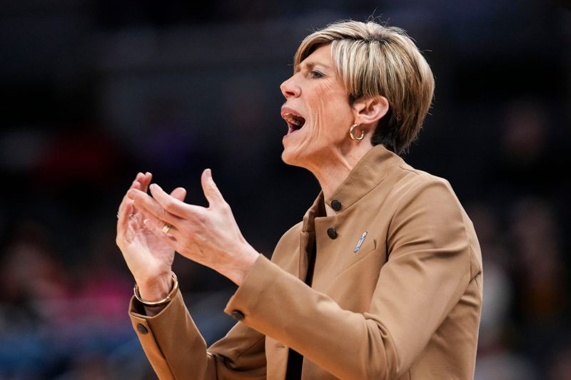 Iowa Hawkeyes head coach Jan Jensen calls out to her team Saturday, March 7, 2026, during a Big Ten women's basketball tournament semifinals game at Gainbridge Fieldhouse in Indianapolis.