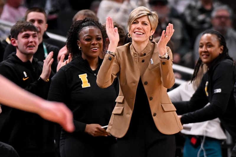 Mar 7, 2026; Indianapolis, IN, USA; Iowa Hawkeyes head coach Jan Jensen claps her hands against the Michigan Wolverines during the second half at Gainbridge Fieldhouse. Mandatory Credit: Robert Goddin-Imagn Images