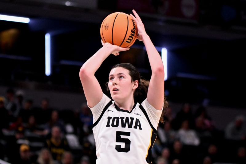 Mar 7, 2026; Indianapolis, IN, USA; Iowa Hawkeyes center Ava Heiden (5) shoots the ball against the Michigan Wolverines during the first half at Gainbridge Fieldhouse. Mandatory Credit: Robert Goddin-Imagn Images