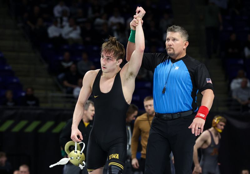 Mar 8, 2026; University Park, PA, USA; Iowa Hawkeyes wrestler Drake Ayala has his arm raised after defeating Illinois Fighting Illini wrestler Lucas Byrd (not pictured) in a 133-pound bout during a consolation semifinal of the Big Ten Wrestling Championships at Bryce Jordan Center. Mandatory Credit: Matthew O'Haren-Imagn Images