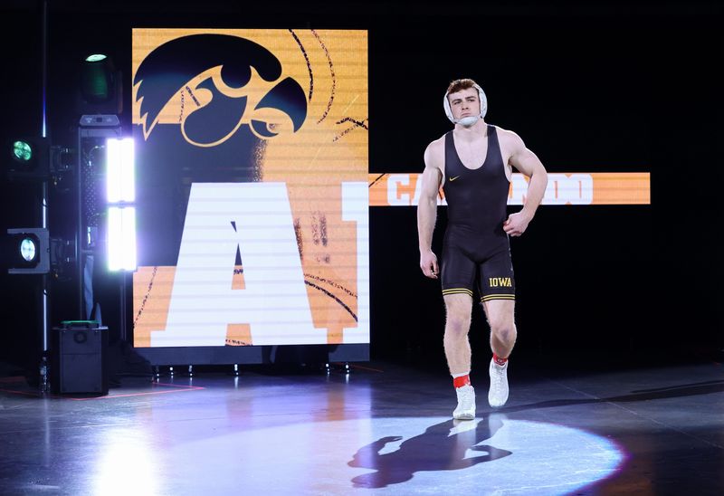 Mar 8, 2026; University Park, PA, USA; Iowa Hawkeyes Mikey Caliendo is introduced prior to his match against Penn State Nittany Lions Mitchell Mesenbrink (not pictured) in the 165-pound championship final of the Big Ten Wrestling Championships at Bryce Jordan Center. Mandatory Credit: Matthew O'Haren-Imagn Images