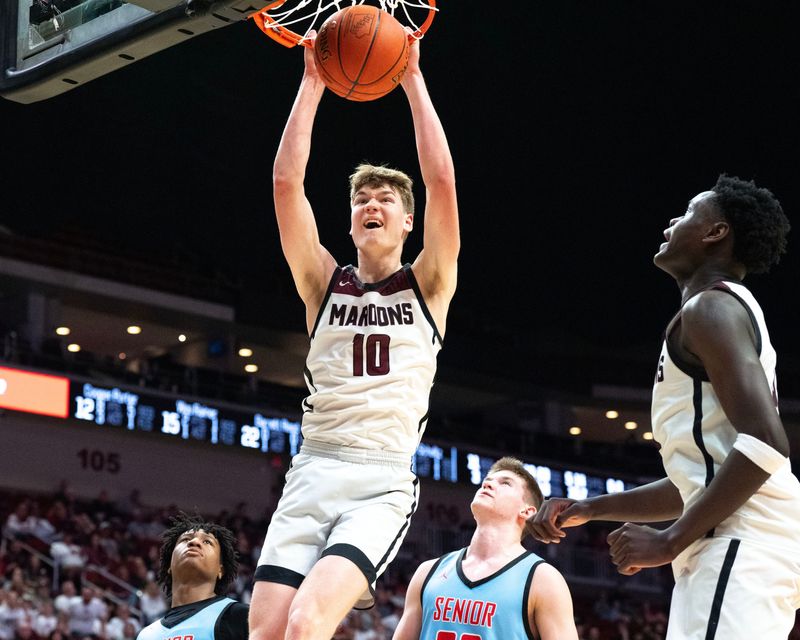 Dowling Catholic’s Charlie Crane (10) dunks against the Dubuque Senior Rams March 9, 2026 during the Iowa high school boys state basketball tournament quarterfinals at the Casey’s Center in Des Moines, Iowa.