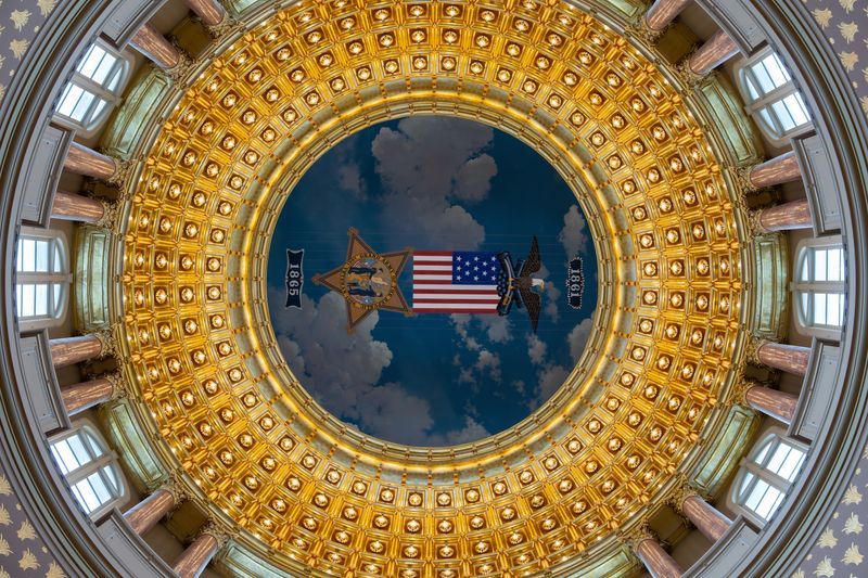 A larger-than-life-size replica of a Grand Army of the Republic badge hangs just below the ceiling of the Iowa Capitol's rotunda, one of many Civil War-related artworks, monuments and artifacts in the building, construction of which began six years after the Union victory in which Iowans played a significant part.