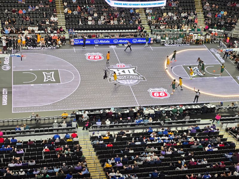 The 3-point line of the ASB GlassFloor LED court lights up during the Arizona State-Baylor game of the 2026 Big 12 men's basketball tournament, Tuesday, March 10, 2026, in T-Mobile Center at Kansas City. The Big 12 introduced the LED court to the conference tournaments this year.