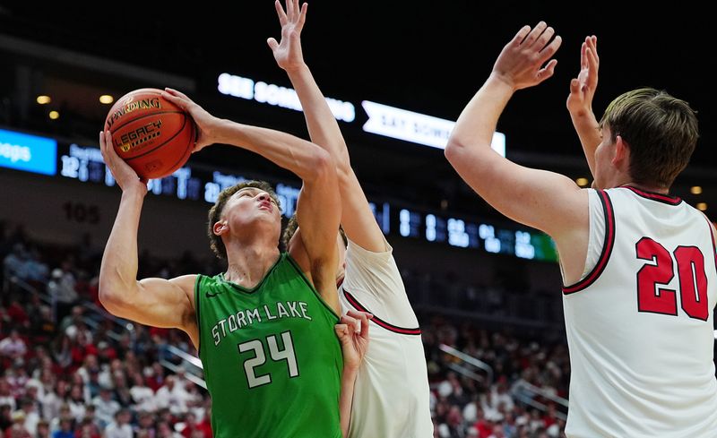 adm20 and ADM Guard/forward Trey Bryte (3) defend as Storm LakeJaidyn Coon (24) shoots the ball during the first quarter in the 3A IIHSAA boys basketball semifinal. on March 11, 2026, at Casey’s Center in Des Moines, Iowa.