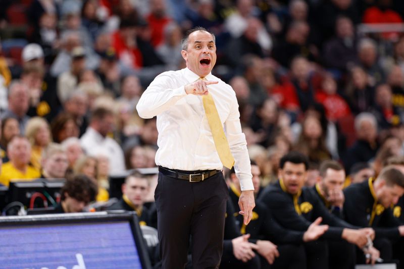 Mar 12, 2026; Chicago, IL, USA; Iowa Hawkeyes head coach Ben McCollum directs his team against the Ohio State Buckeyes during the first half at United Center. Mandatory Credit: Kamil Krzaczynski-Imagn Images