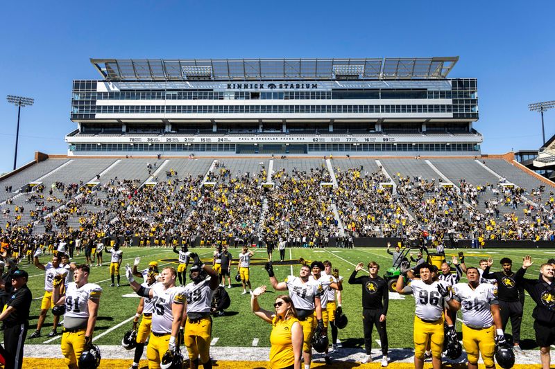 Apr 26, 2025; Iowa City, IA, USA; Iowa Hawkeyes players wave to patients in the Stead Family Childrenâ€™s Hospital during a spring NCAA football open practice at Kinnick Stadium. Mandatory Credit: Joseph Cress-The Des Moines Register