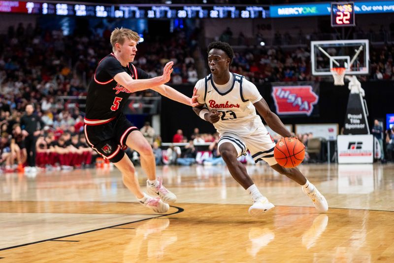 Ballard’s Jude Gibson (23) drives to the basket against ADM's Eli Wiebers (5) on March 13, 2026, at Casey's Center in Des Moines.