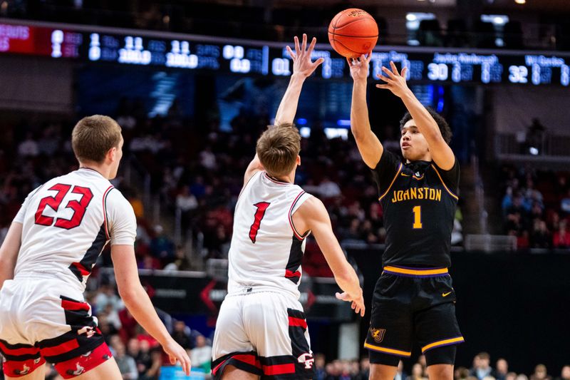 Johnston's Nicare Cavil (1) shoots a three-pointer against Cedar Fall's Parker Berns (1) on March 13, 2026, at Casey’s Center in Des Moines.