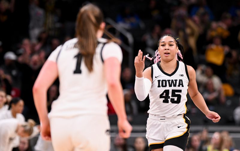 Mar 7, 2026; Indianapolis, IN, USA; Iowa Hawkeyes forward Hannah Stuelke (45) celebrates after a play against the Michigan Wolverines during the second half at Gainbridge Fieldhouse. Mandatory Credit: Robert Goddin-Imagn Images