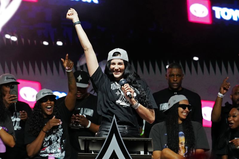 Las Vegas Aces center Megan Gustafson (17) talks to fans gathered to celebrate the Las Vegas Aces 2025 WNBA Championship on Oct. 17, 2025, at Toshiba Plaza in Las Vegas.
