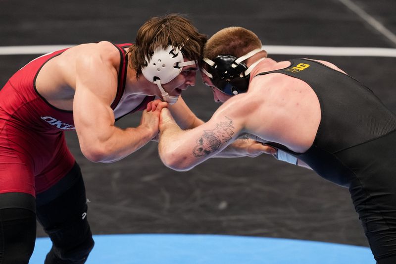 Mar 19, 2026; Cleveland, OH, USA; Iowa Hawkeye Patrick Kennedy competes against Oklahoma Sooners Carter Schubert during the NCAA DI Wrestling Championship at Rocket Arena. Mandatory Credit: Aaron Doster-Imagn Images