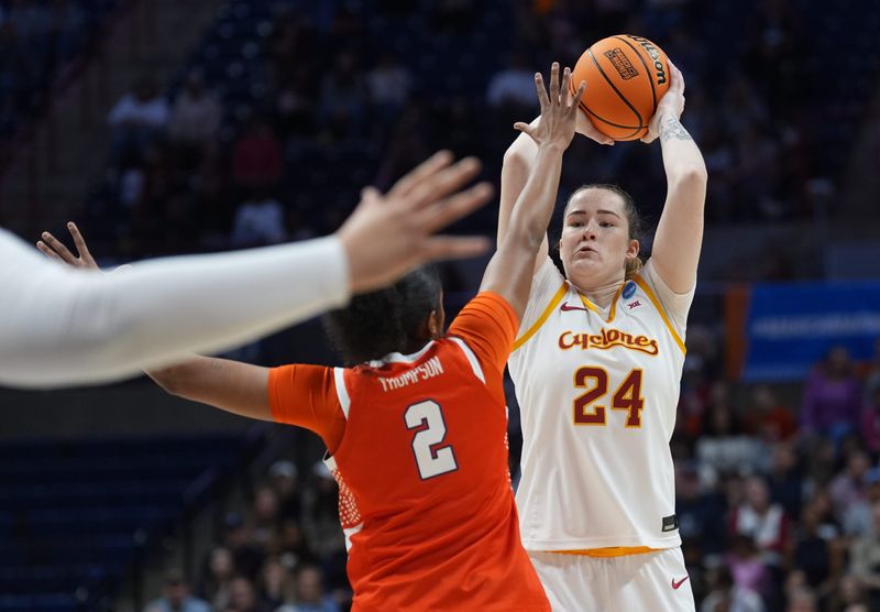 Mar 21, 2026; Storrs, CT, USA; Iowa State Cyclones forward Addy Brown (24) looks to pass the ball against Syracuse Orange forward Journey Thompson (2) in the first half at Harry A. Gampel Pavilion. Mandatory Credit: David Butler II-Imagn Images