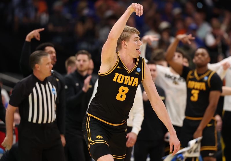 Mar 22, 2026; Tampa, FL, USA; Iowa Hawkeyes forward Cooper Koch (8) celebrates after a play against the Florida Gators in the second half during a second round game of the men's 2026 NCAA Tournament at Benchmark International Arena. Mandatory Credit: Matt Pendleton-Imagn Images