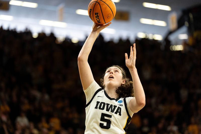 Iowa center Ava Heiden (5) shoots the basketball March 23, 2026 during a Round of 32 NCAA March Madness game against the Virginia Cavaliers at Carver-Hawkeye Arena in Iowa City, Iowa.