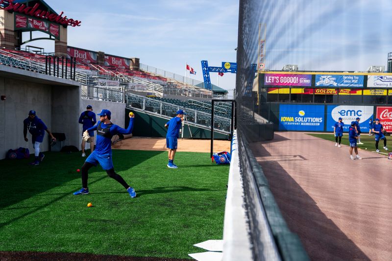 Iowa Cubs players warm up before practice on March 25, 2026, at Principal Park in Des Moines.
