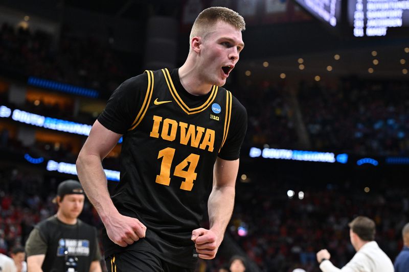 Bennett Stirtz celebrates Iowa's 77-71 win over Nebraska in the NCAA Tournament Sweet 16 on March 26 in Houston, Texas. Stirtz had 20 points, four assists, no turnovers and the go-ahead 3-pointer in the final minutes.