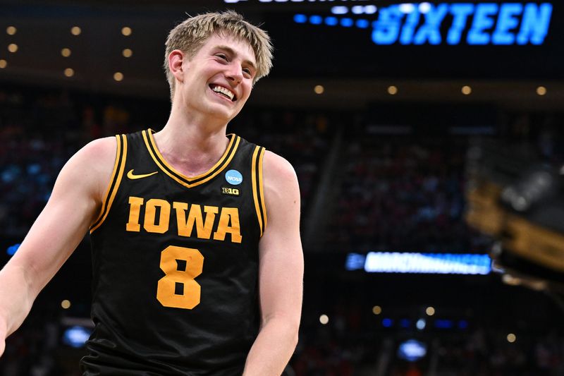 Mar 26, 2026; Houston, TX, USA; Iowa Hawkeyes forward Cooper Koch (8) reacts after beating the Nebraska Cornhuskers during a Sweet Sixteen game of the South Regional of the men's 2026 NCAA Tournament at Toyota Center. Mandatory Credit: Maria Lysaker-Imagn Images