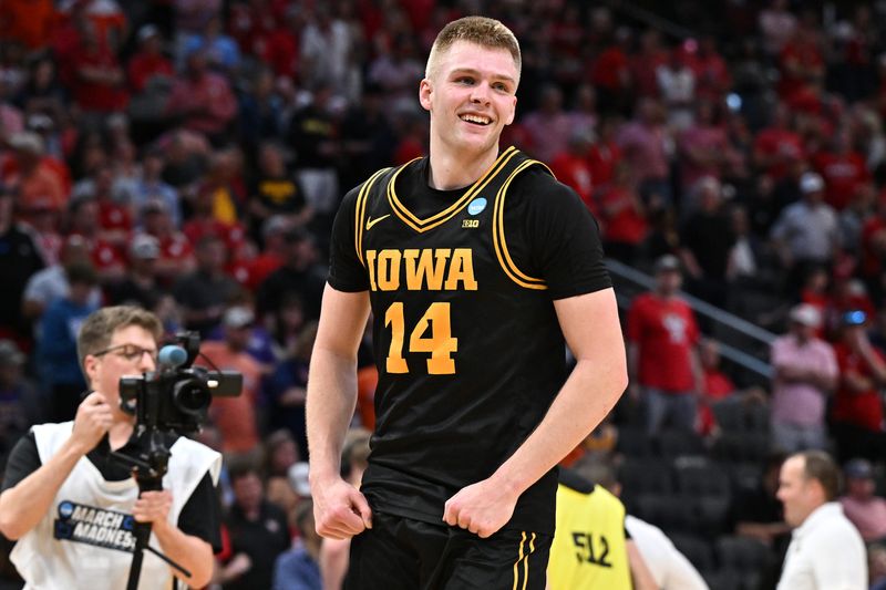 Mar 26, 2026; Houston, TX, USA;Iowa Hawkeyes guard Bennett Stirtz (14) reacts after beating the Nebraska Cornhuskers during a Sweet Sixteen game of the South Regional of the men's 2026 NCAA Tournament at Toyota Center. Mandatory Credit: Maria Lysaker-Imagn Images
