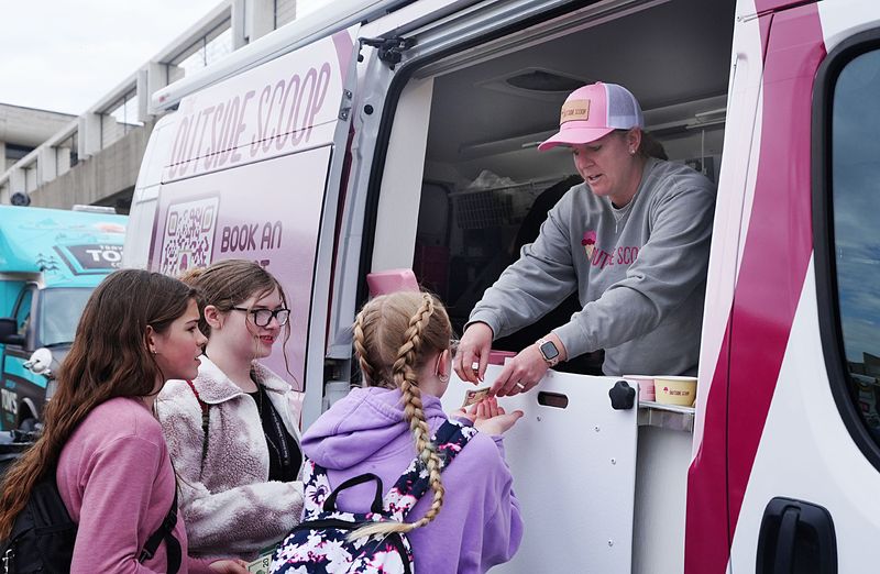 Lyndsey Fennelly, franchise owner of The Outside Scoop, sells ice cream from her food truck at the Iowa State Center on March 24, 2026, in Ames, Iowa.