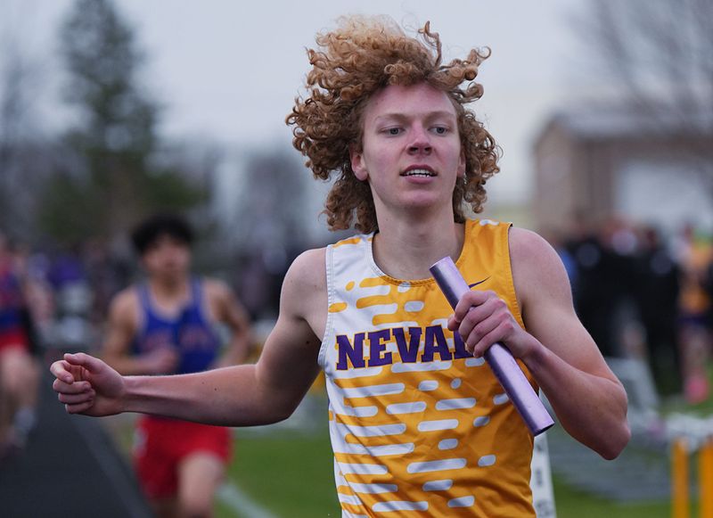 Nevada's Dawson Lemke anchors the Cubs to victory in the 4x800-meter relay at the Nevada Invitational boys track and field meet at Cub Stadium on March 31 in Nevada, Iowa.