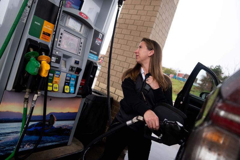 Brynn Gelhaye fills up their car with gas on April 2, 2026, at a Maverik station in Des Moines.