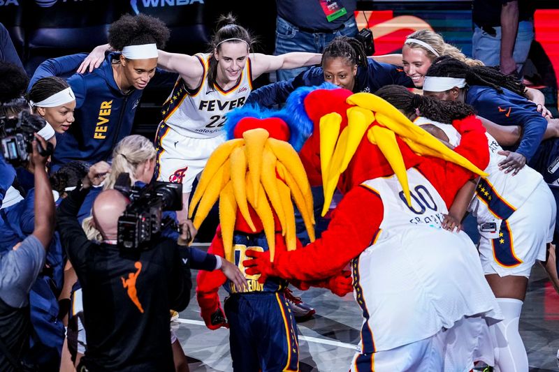 The Indiana Fever huddle up after team introductions Saturday, May 24, 2025, during a game between the Indiana Fever and the New York Liberty at Gainbridge Fieldhouse in Indianapolis.