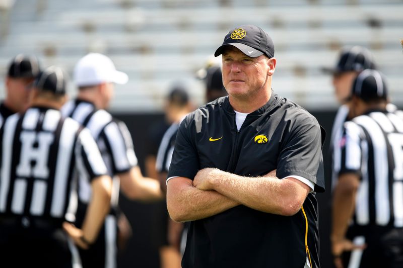 Aug 9, 2025; Iowa offensive line coach George Barnett looks on during the Hawkeyes Kids Day NCAA football open practice at Kinnick Stadium in Iowa City, Iowa. Mandatory Credit: Joseph Cress for the Des Moines Register