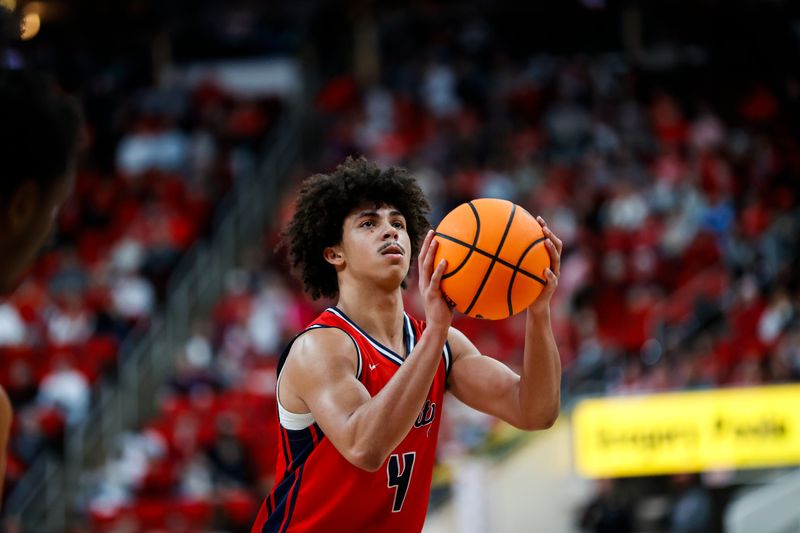 Dec 6, 2025; Raleigh, North Carolina, USA; 
Liberty Flames guard Brett Decker Jr. (4) shoots a free throw during the second half of the game against the NC State Wolfpack at Lenovo Center. Mandatory Credit: Jaylynn Nash-Imagn Images