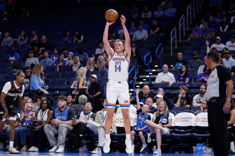 Apr 12, 2026; Oklahoma City, Oklahoma, USA; Oklahoma City Thunder forward Payton Sandfort (14) shoots a three point basket against the Phoenix Suns during the second half at Paycom Center. Mandatory Credit: Alonzo Adams-Imagn Images