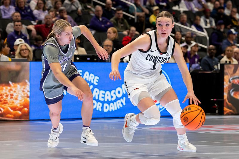 Mar 6, 2026; Kansas City, MO, USA; Oklahoma State Cowgirls guard Amari Whiting (1) attempts to edge around Kansas State Wildcats guard Taryn Sides (11) during the first half at T-Mobile Center. Mandatory Credit: Nick Tre. Smith-Imagn Images