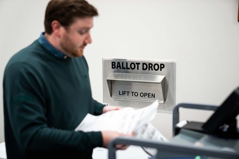 Test ballots are submitted into the voting machine on April 15, 2026, at the Polk County Election Office.