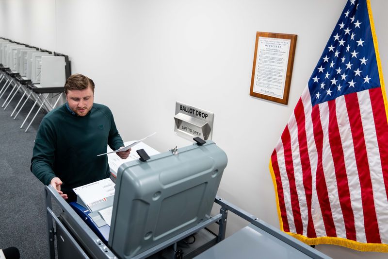 Test ballots are submitted into the voting machine on April 15, 2026, at the Polk County Election Office.