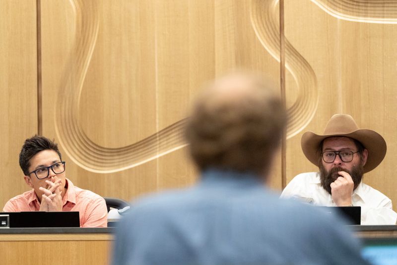 Johnson County Supervisors V Fixmer-Oraiz, left, and Jon Green listen to county Finance Director Dana Aschenbrenner during a public hearing on the proposed fiscal year 2027 budget estimate April 15, 2026 in Iowa City, Iowa.