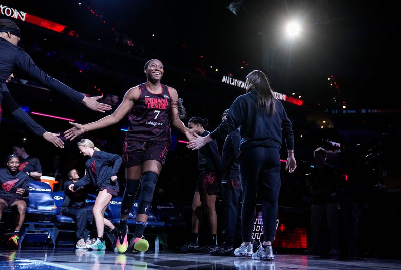 Indiana Fever forward Aliyah Boston (7) high-fives teammates during team introductions Thursday, July 24, 2025, during the game at Gainbridge Fieldhouse in Indianapolis.