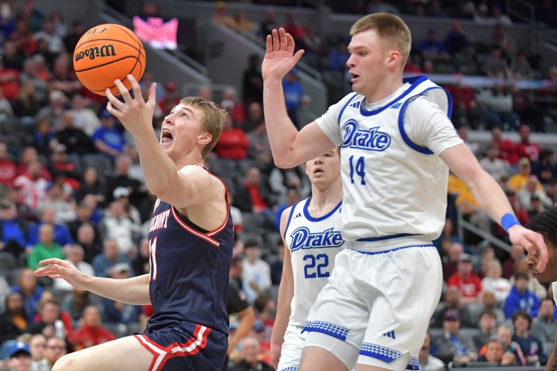 Mar 8, 2025; St. Louis, MO, Belmont Bruins forward Drew Scharnowski (11) catches the ball in front of Drake Bulldogs guard Bennett Stirtz (14) during the first half at Enterprise Center. Mandatory Credit: Ron Johnson-Imagn Images