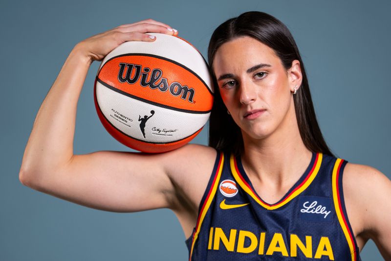 Indiana Fever guard Caitlin Clark (22) poses for a photo Wednesday, April 22, 2026, during media day at Gainbridge Fieldhouse in Indianapolis.