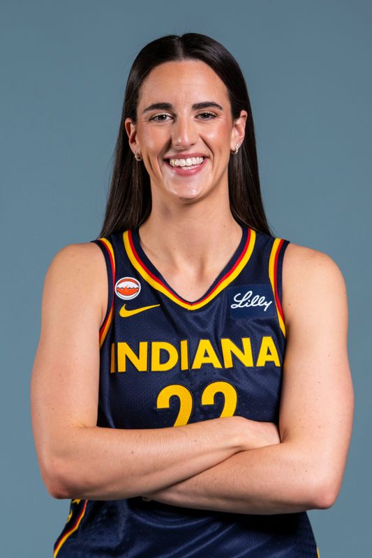 Indiana Fever guard Caitlin Clark (22) poses for a photo Wednesday, April 22, 2026, during media day at Gainbridge Fieldhouse in Indianapolis.