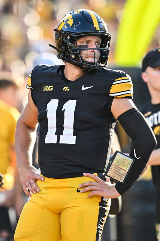 Sep 13, 2025; Iowa City, Iowa, USA; Iowa Hawkeyes quarterback Mark Gronowski (11) looks on before the game against the Massachusetts Minutemen at Kinnick Stadium. Mandatory Credit: Jeffrey Becker-Imagn Images